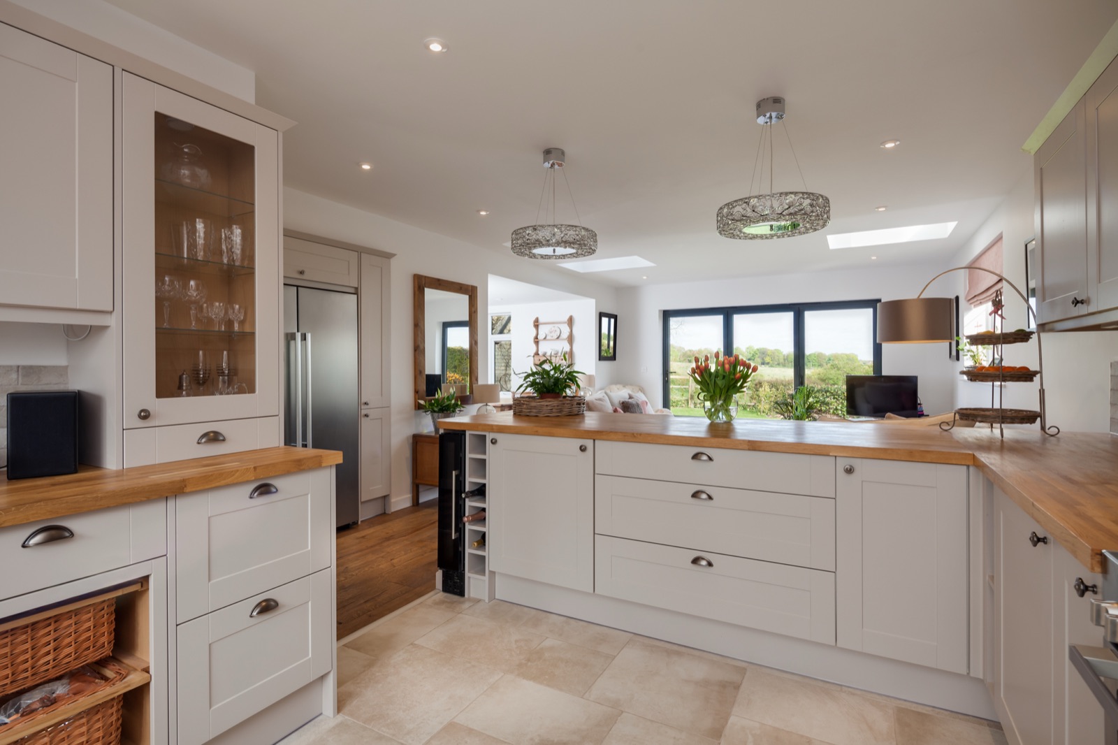 Classic shaker kitchen with oak worktops and a view over open countryside