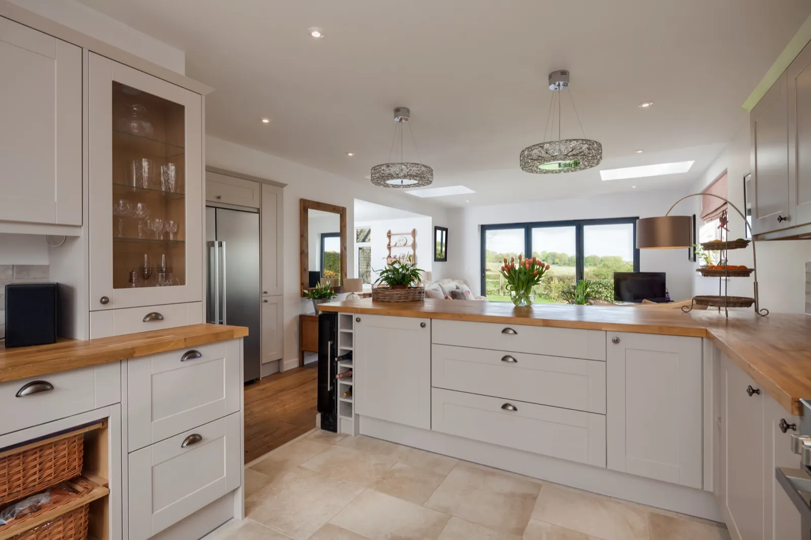 Classic shaker kitchen with oak worktops and a view over open countryside