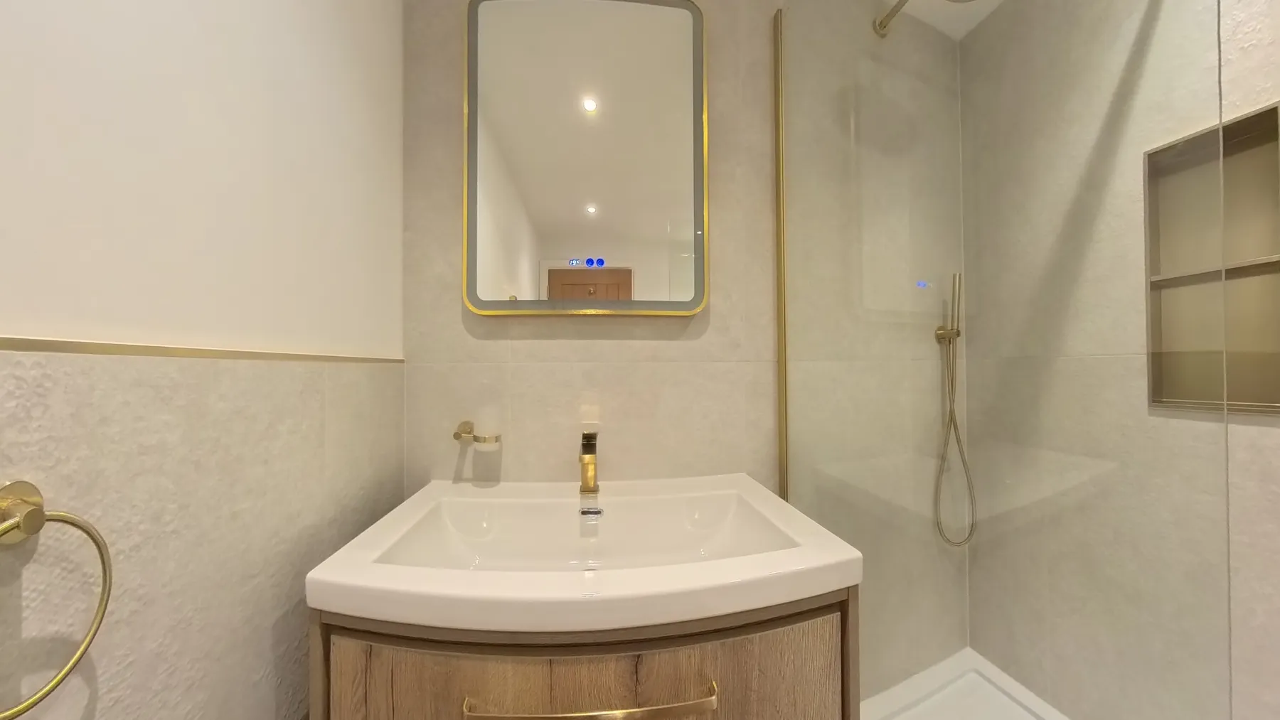 The new ensuite finished with brass fittings and a walk-in shower