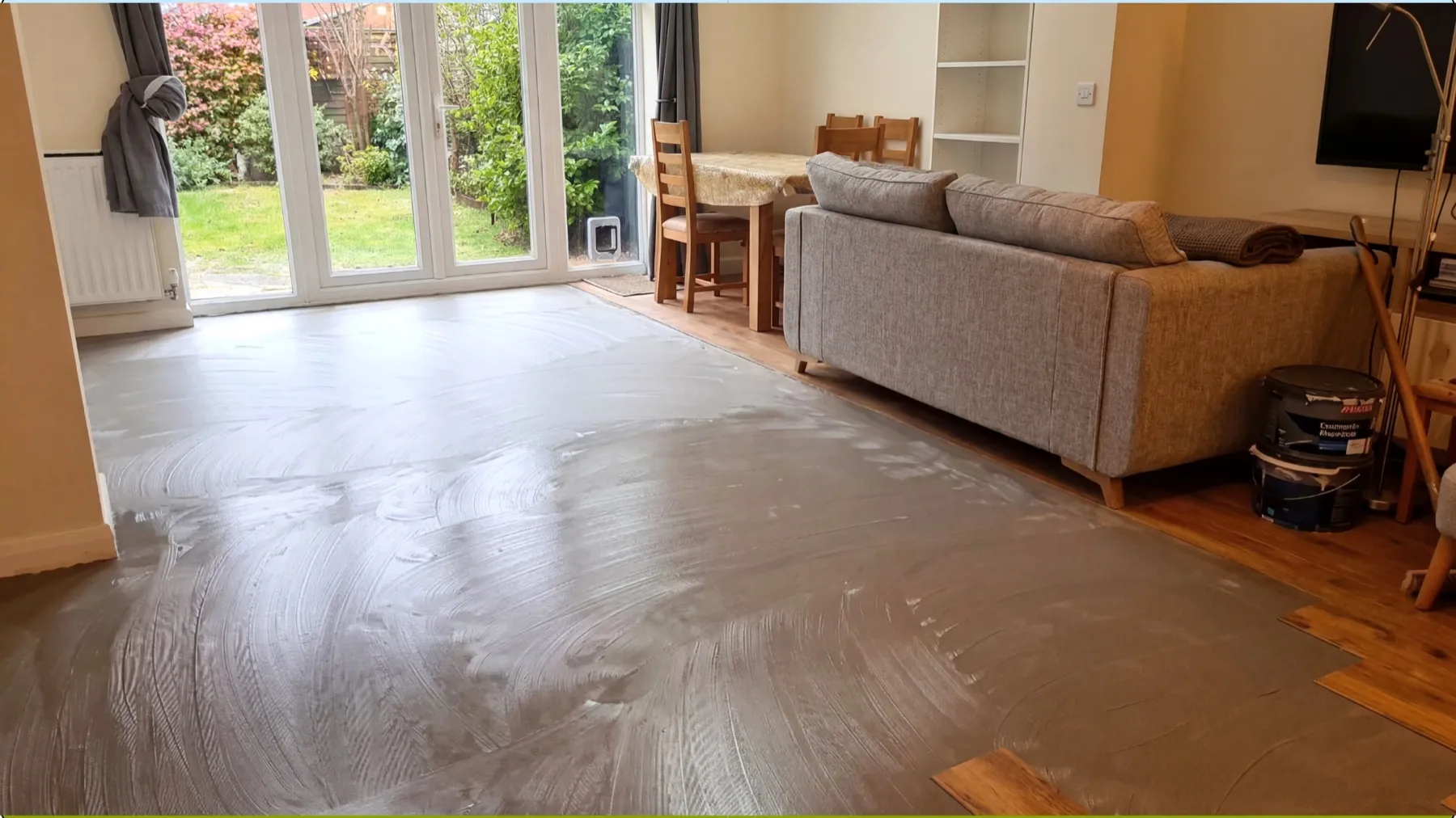 Glue-down luxury vinyl tile installation underway