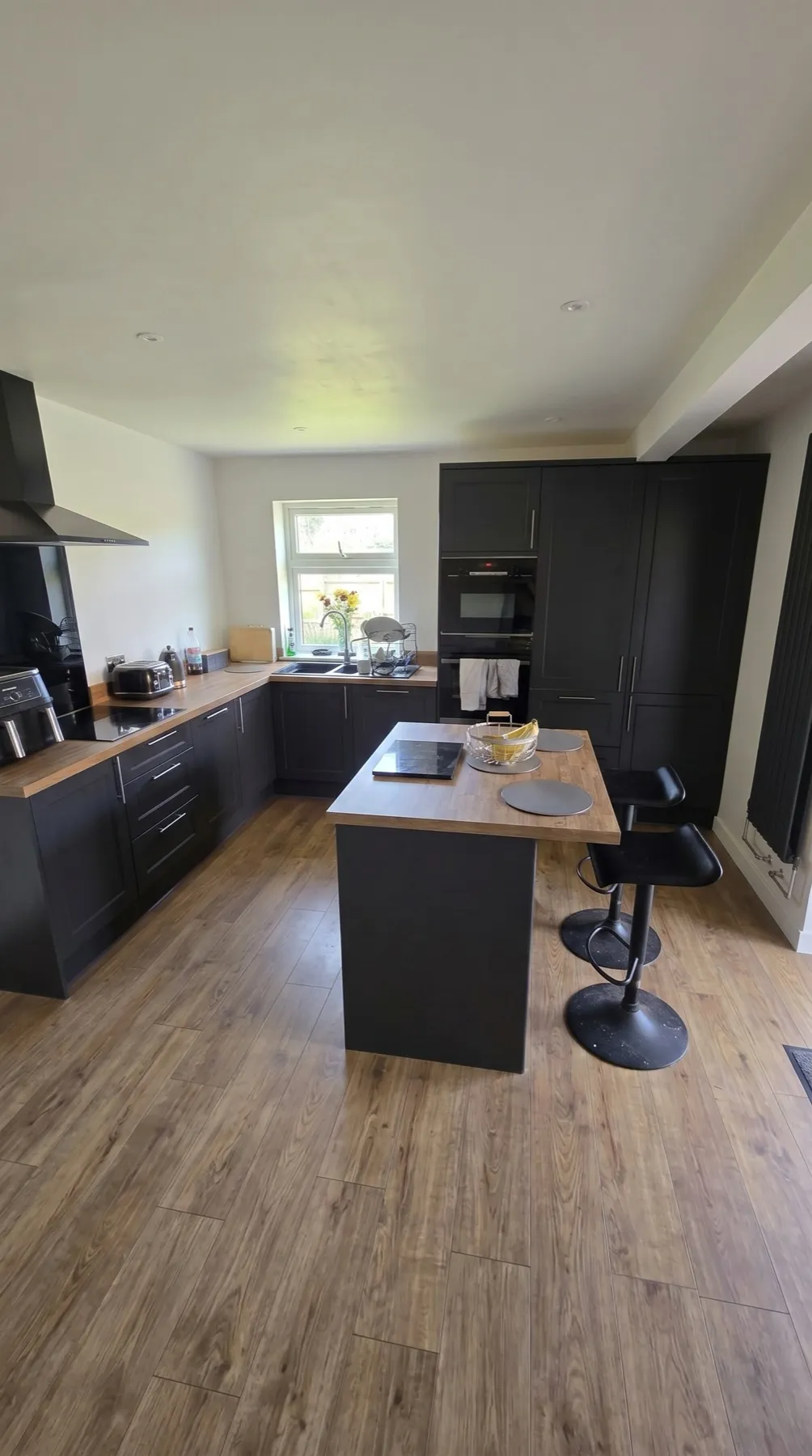 The same kitchen after a full renovation by Refined Interior Finishes